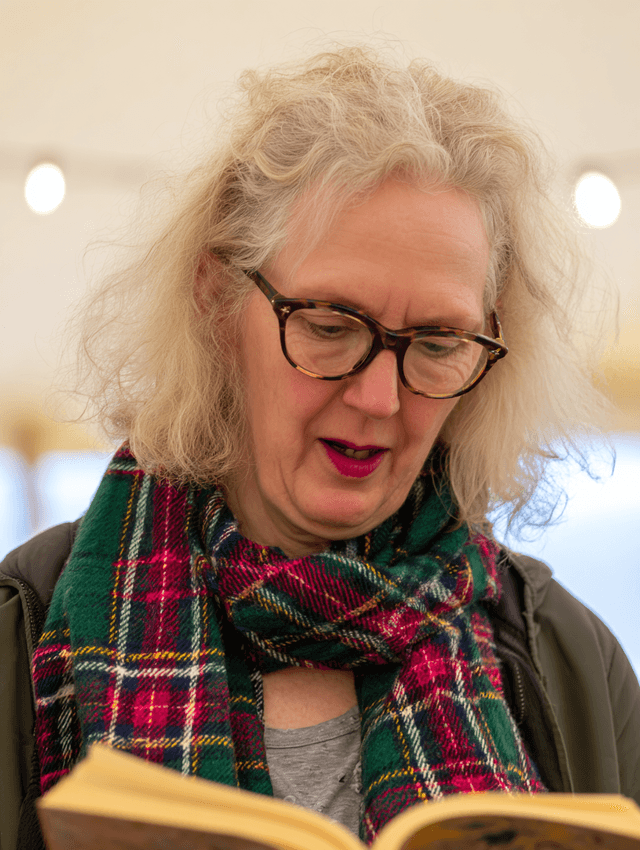 Festival reader with tartan scarf